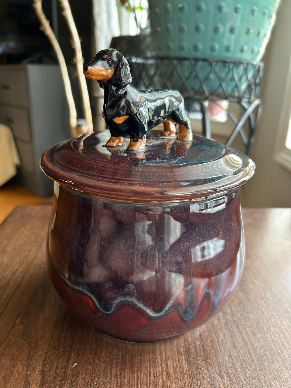 Mudipaws Pottery ceramic treat jar topped w/ a dachshund by artist Debi Manduca